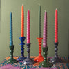 The Window, Milford Haven set of six colourful twisted stearin wax dinner candles in various twilight-inspired shades.