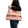The Window, Milford Haven Big Star vintage cotton tote bag with leather handles and trim carried on a shoulder