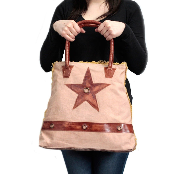 The Window, Milford Haven vintage cotton tote bag in beige with brown leather star applique and sturdy leather handles.