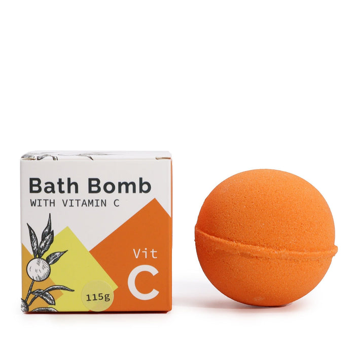 The Window, Milford Haven Vitamin C bath bomb in bright orange next to its illustrated citrus-themed packaging box.