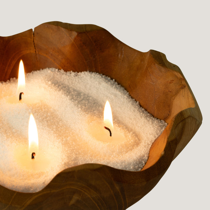The Window, Milford Haven white unfragranced candle sand burning with three cotton wicks in a rustic wooden bowl