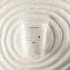 The Window, Milford Haven white unfragranced candle sand in a resealable pouch surrounded by loose wax beads