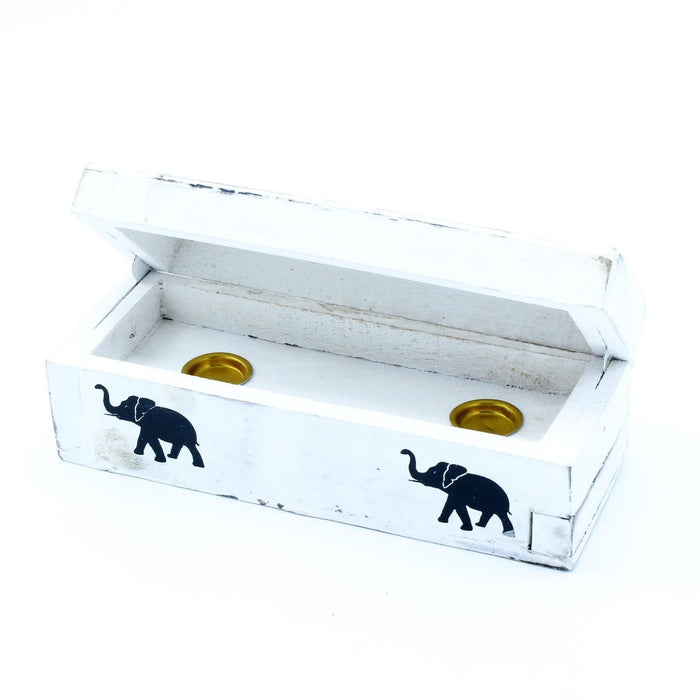 The Window, Milford Haven white-washed mango wood incense box with two brass cone holders and black elephant motifs.