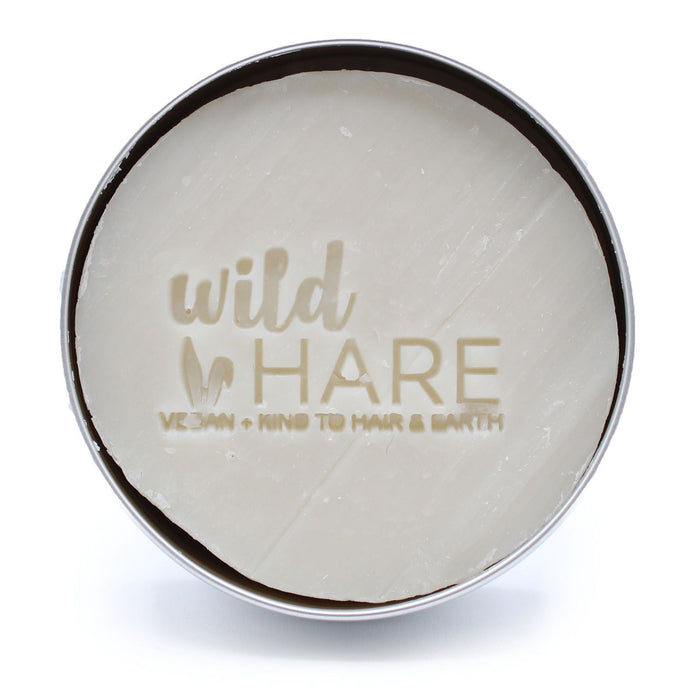 The Window, Milford Haven Wild Hare Hairy Coconut solid shampoo bar in a round metal tin with embossed branding