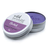 The Window, Milford Haven Wild Hare Orchid solid shampoo bar in a metal travel tin with purple soap visible inside.