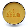 The Window, Milford Haven Wild Hare solid papaya shampoo bar in a round metal tin with embossed logo