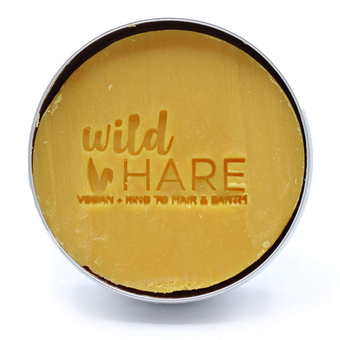 The Window, Milford Haven Wild Hare solid papaya shampoo bar in a round metal tin with embossed logo
