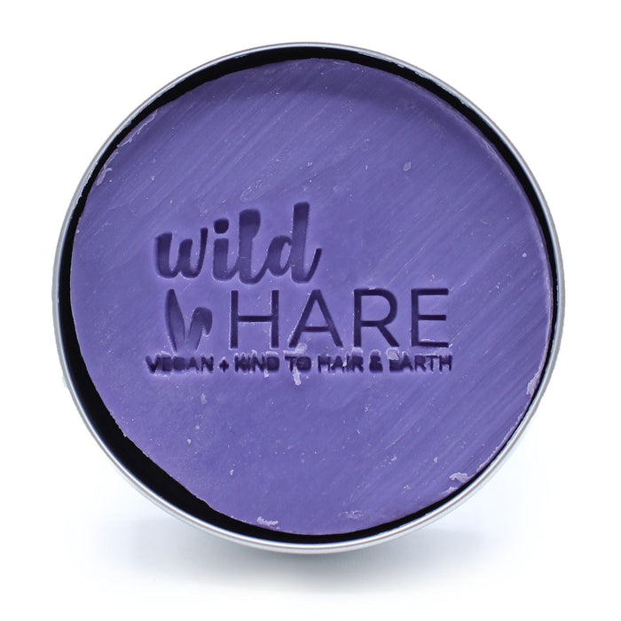 The Window, Milford Haven Wild Hare purple orchid solid shampoo bar with embossed logo in a round metal tin.
