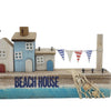The Window, Milford Haven wooden coastal beach house ornament with blue and white painted houses and bunting detail.