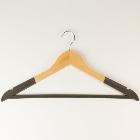 The Window, Milford Haven wooden clothes hanger with non-slip dark grey sections and a sturdy metal hook.
