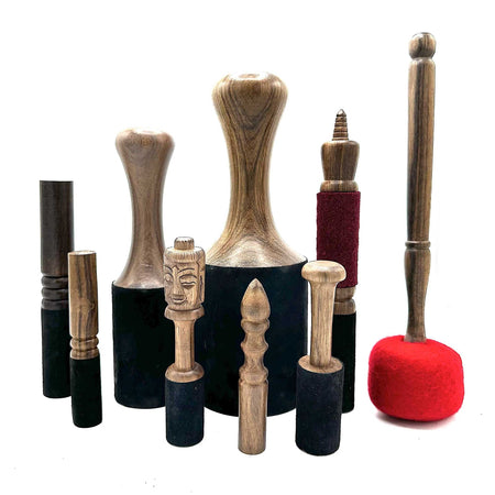 The Window, Milford Haven collection of wooden Terminalia Elliptica gong sticks and singing bowl mallets from Nepal.