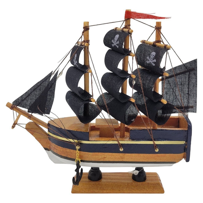 The Window, Milford Haven wooden pirate ship model with black fabric sails, skull and crossbones, and metal anchor.