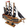 The Window, Milford Haven small wooden pirate ship model with black fabric sails and a decorative metal anchor