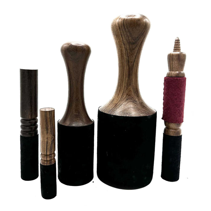 The Window, Milford Haven wooden singing bowl strikers in various sizes with felt and suede covers on white background