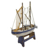 The Window, Milford Haven large wooden trawler model with rustic blue and white finish, netting, and display stand.