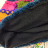 The Window, Milford Haven patchwork wool bobble hat interior showing soft black fleecy polyester lining