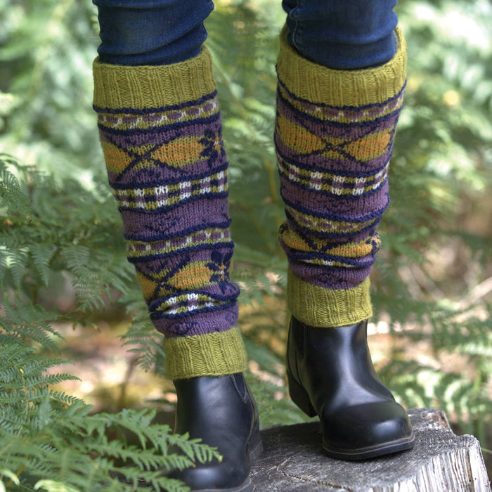 The Window, Milford Haven hand-knitted wool leg-warmers in Cosmos and Highland green with geometric patterns.
