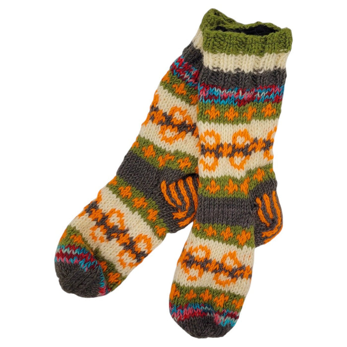 The Window, Milford Haven hand-knitted wool lounge socks with a colourful fair isle pattern and soft fleece lining.