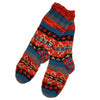 The Window, Milford Haven hand-knitted wool lounge socks with a colourful patterned design and fleece lining.