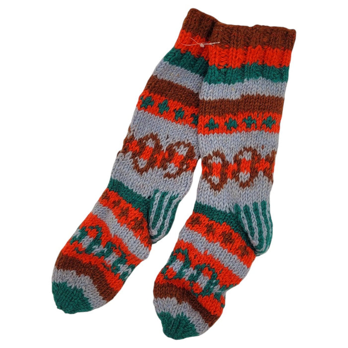 The Window, Milford Haven hand-knitted wool lounge socks with a colourful geometric pattern and fleece lining.