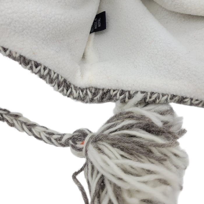 The Window, Milford Haven handmade wool wolf hat with soft white fleece lining and braided tassel detail