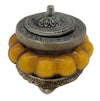 The Window, Milford Haven Precious Sandal scented soy candle in a yellow pumpkin-shaped glass jar with ornate metal lid