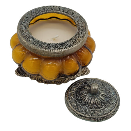 The Window, Milford Haven yellow Precious Sandal scented soy candle in an antique pumpkin-shaped glass jar with metal lid