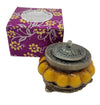The Window, Milford Haven Song Of India yellow Precious Sandal scented candle in an antique-style pumpkin glass jar.