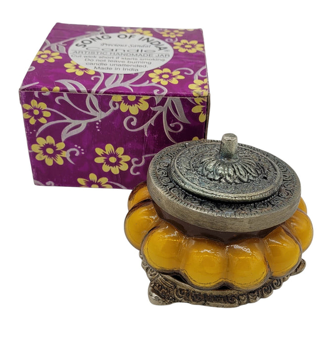 The Window, Milford Haven Song Of India yellow Precious Sandal scented candle in an antique-style pumpkin glass jar.