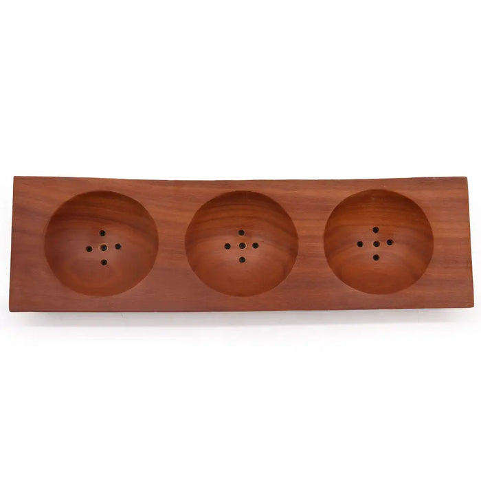 Rectangular naseberry wood soap dish with three circular compartments and small holes for soap drainage