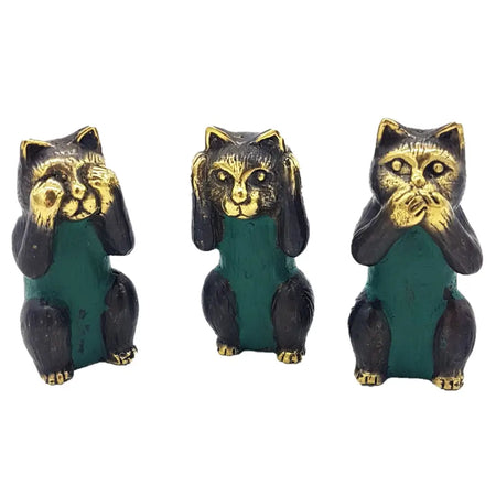 Set of three brass cats in black and gold with green bodies showing see no evil hear no evil speak no evil gestures