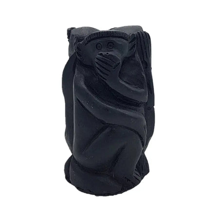 Black carved wooden monkey figurine with textured matte finish showing three wise monkeys theme