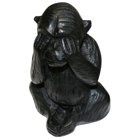 Black carved wooden three wise monkeys figurines showing hands covering eyes ears and mouth in a set of three mystic apes