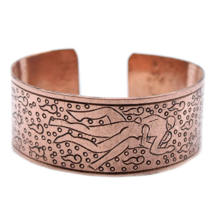 Tibetan mantra bracelet with extra wide copper band engraved with a figure swimming among bubbles and swirls