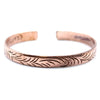 Copper tibetan mantra bracelet with engraved leaf pattern featuring tribal swirls on narrow cuff design