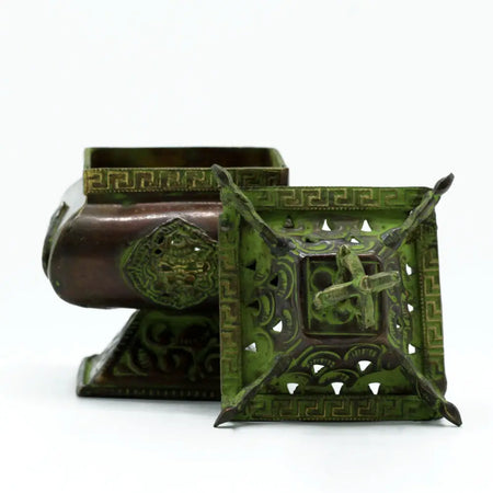 Antique bronze square standing pot incense burner with green patina and detailed mythical creature carvings