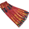 A soft plush tie-dye velvet handwarmer gloves in vibrant reds oranges and blues with cozy textured fabric