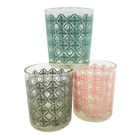 Set of three glass tealight holders in teal gray and pink with intricate tiled pattern designs