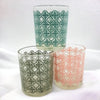 Three translucent glass tealight holders with a tiled pattern in pastel mint green dusty rose and sage gray with clear rims
