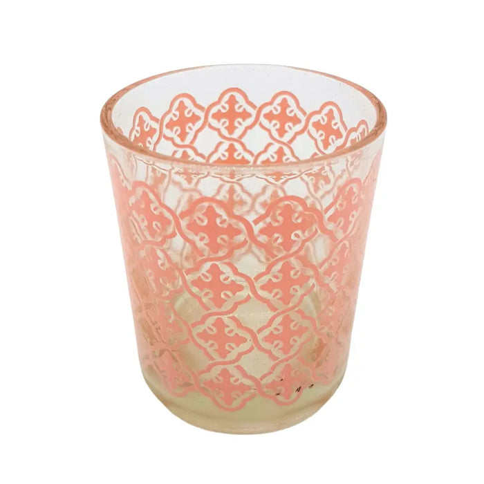 A clear glass tealight holder with a delicate peach tiled pattern etched across its surface