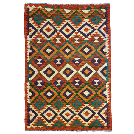 Traditional afghan flat-weave kilim rug with bold orange green purple and cream geometric tribal pattern in 100% wool
