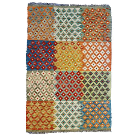 Traditional afghan flat-weave kilim rug with colorful orange blue red and green geometric patterns made of 100 wool