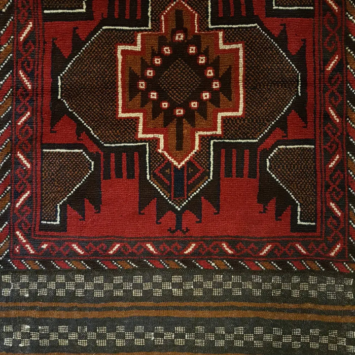 Traditional afghan mushwani rug in rich red and dark brown wool with white black and tan geometric patterns