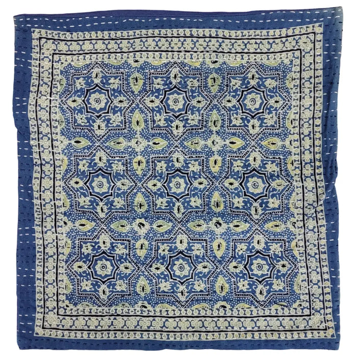 Traditional blue kantha cushion cover with intricate cream black and pale green geometric and floral patterns on standard cushion