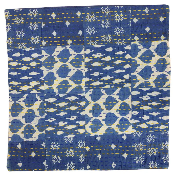 Traditional blue kantha patchwork cushion cover with white fabric, yellow stitching, sun motifs, and abstract patterns