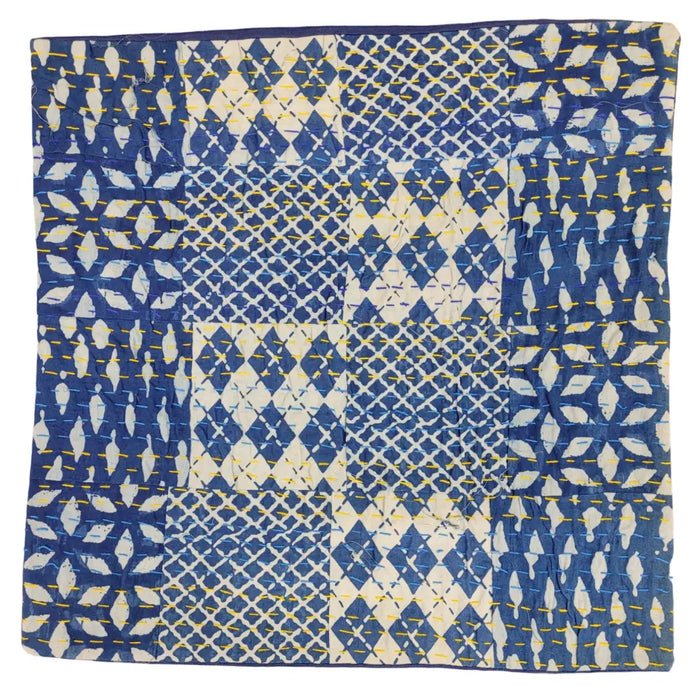 Traditional blue kantha patchwork cushion cover with blue and white fabric and yellow stitched geometric patterns