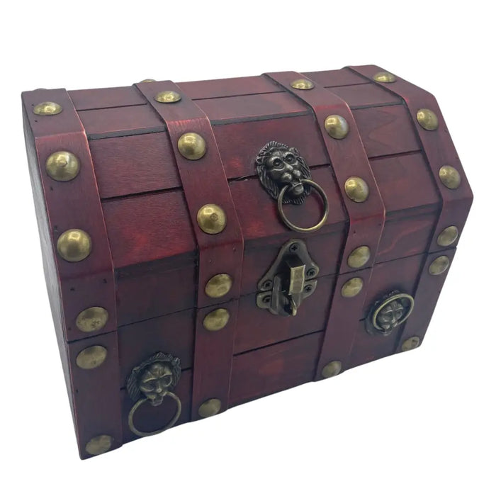 A rich burgundy wooden treasure chest with brass rivets and lion-head ring pulls for storage and decor