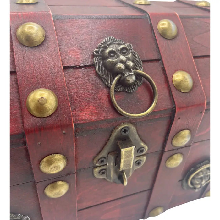 Red wooden treasure chest storage box with brass lion head handle and decorative metal studs on front panel