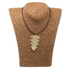 Gold leaf-shaped tree leaf necklace pendant on a black cord showing a simple leaf necklace design