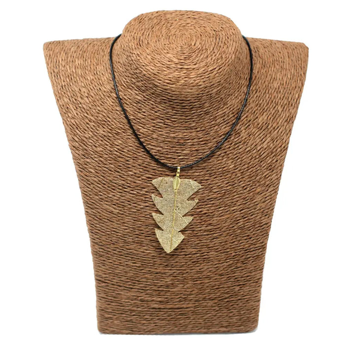 Gold leaf-shaped tree leaf necklace pendant on a black cord showing a simple leaf necklace design